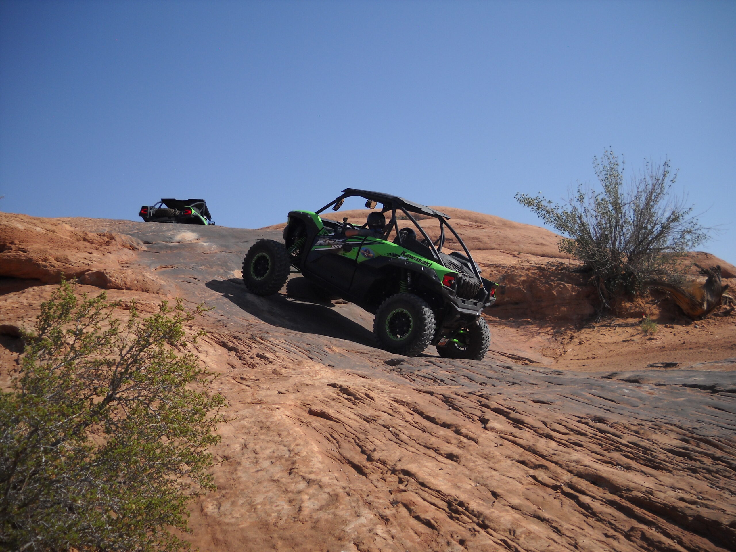 Guest loving one of Moab's most iconic trails Poison Spider Mesa on there unforgettable UTV Side by Side tour