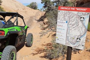 Stopped at the wedgie obstacle for our guide to show them how its done on the Poison Spider Mesa UTV side by side tour