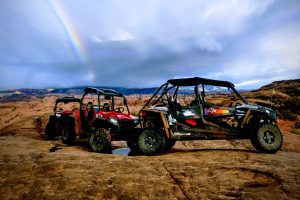 Guest loving the rainbow on Hell's Revenge ATV side by side tour in Moab.