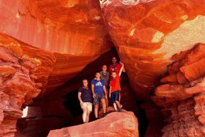 Family exploring the Catacomb Caves guest favorite family adventure UTV tour