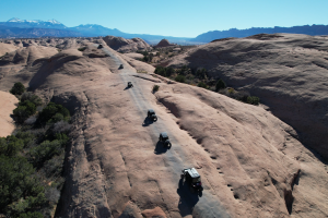 Group hitting the famous slick rock on Hells Revenge UTV tour