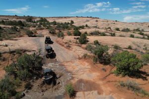 Guided UTV side by side tour on Hell's Revenge trail after a rain storm, bringing it to the next level!